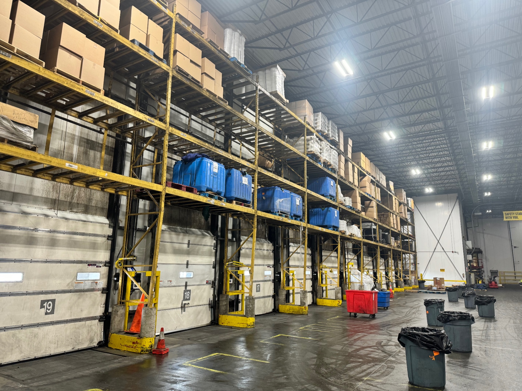 Spotless warehouse interior with high ceilings and organized racking
